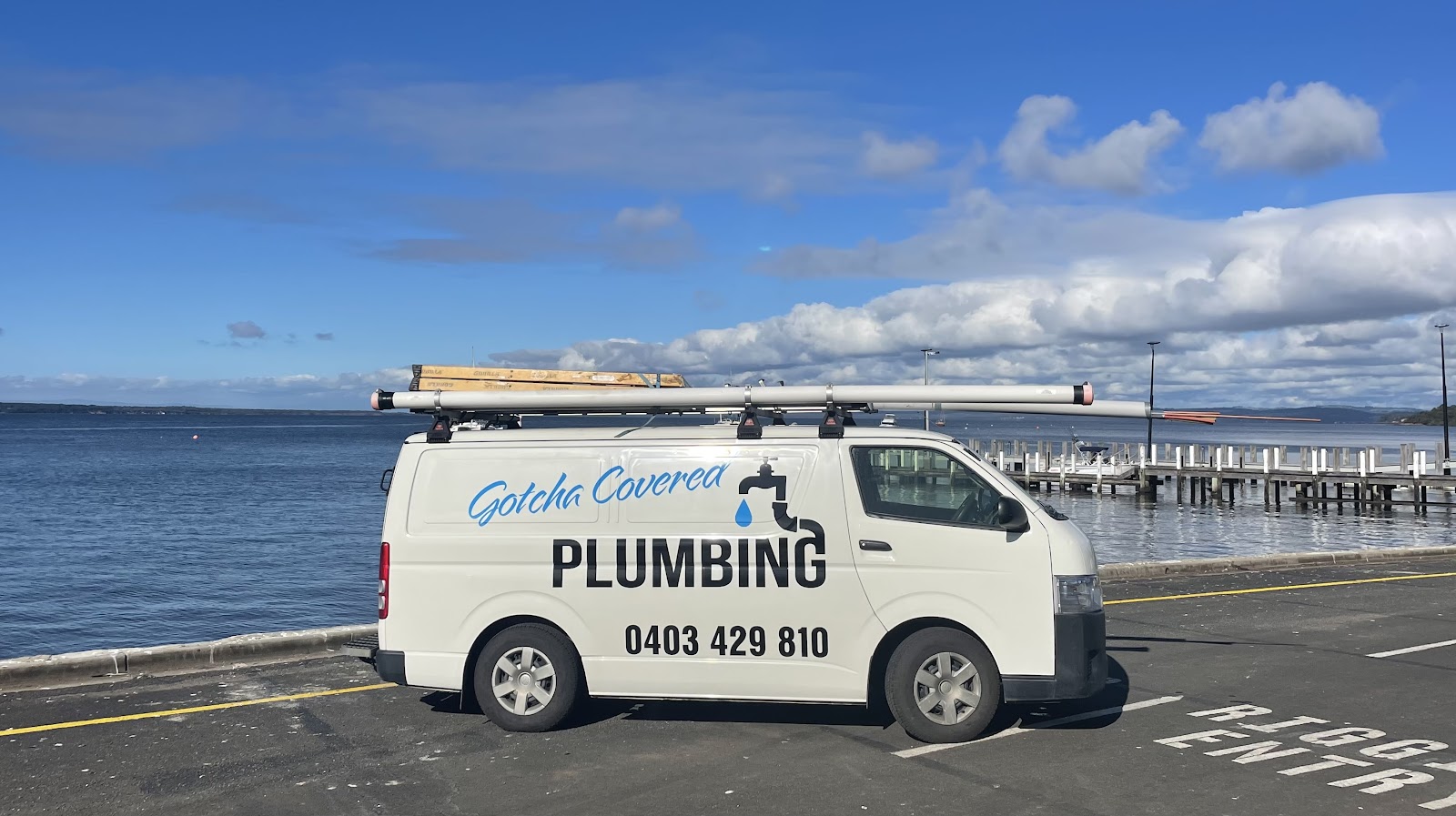 The GotchaCovered Plumbing van parked by the water in Gippsland